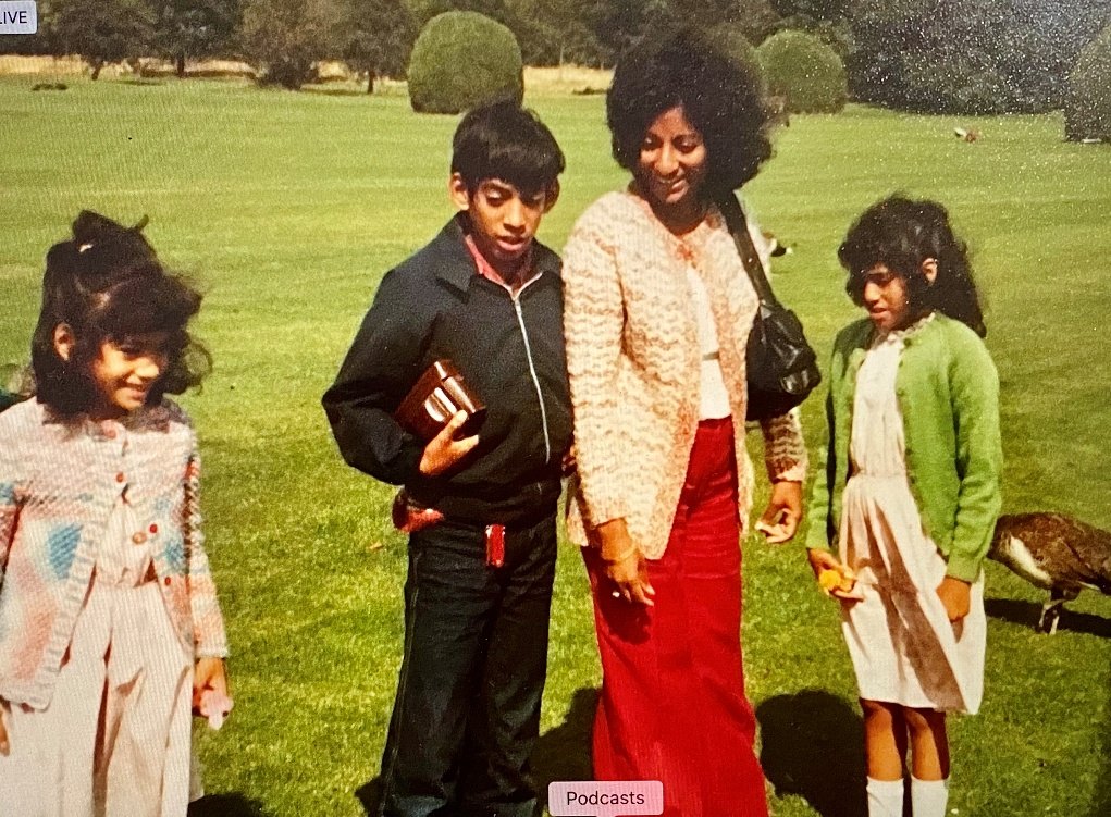 Grace on a lawn with her three young children in the 1970s.