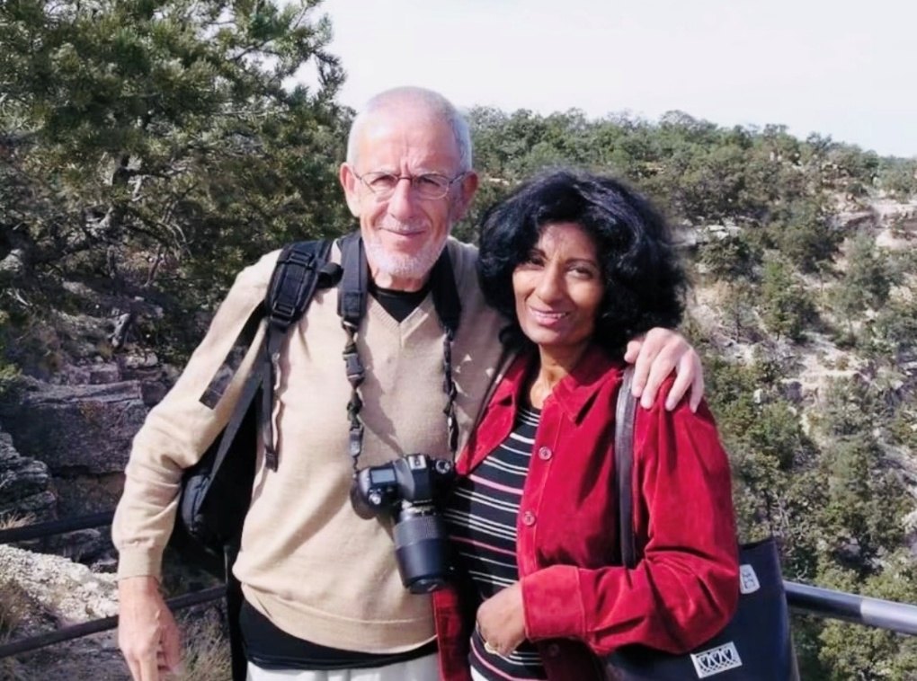 Grace and Phillip standing together on a canyon rim in Arizona.